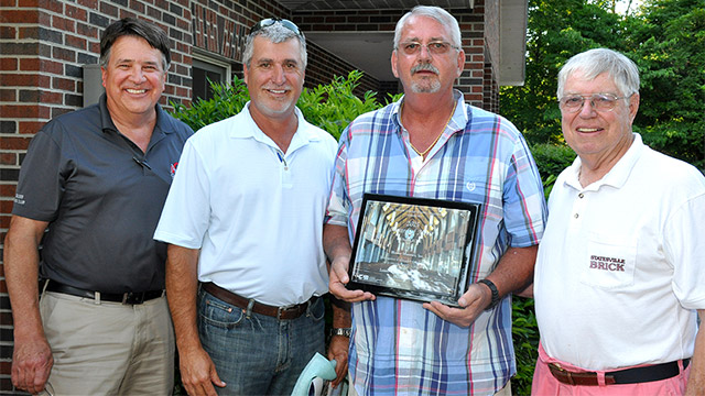 Leland Eckard (second from right) receives the NCMA 2015 Concrete Masonry Design Award of Excellence/Award of Merit/Commercial Division.