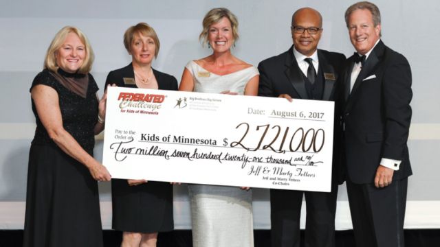 Federated Challenge Co-Chairs Jeff and Marty Fetters present Minnesota’s three Big Brothers Big Sisters agencies with a check for $2.7 million. From left to right: Marty Fetters, Jackie Scholl Johnson, Michelle Redman, Michael Goar, and Jeff Fetters.