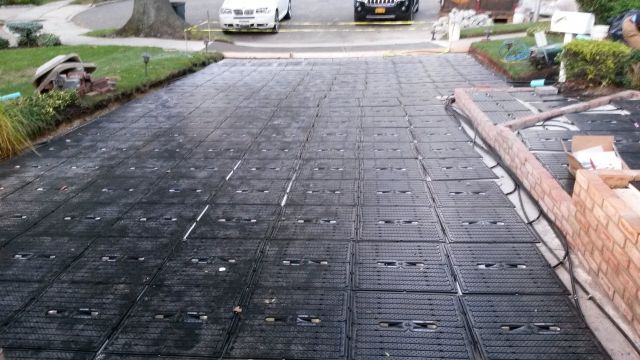 ThermaPANEL units laid out and connected in New Hyde Park, N.Y. The driveway will be snow-melted during winter months, and the panels will collect solar thermal energy in the summer to heat the pool in the backyard.